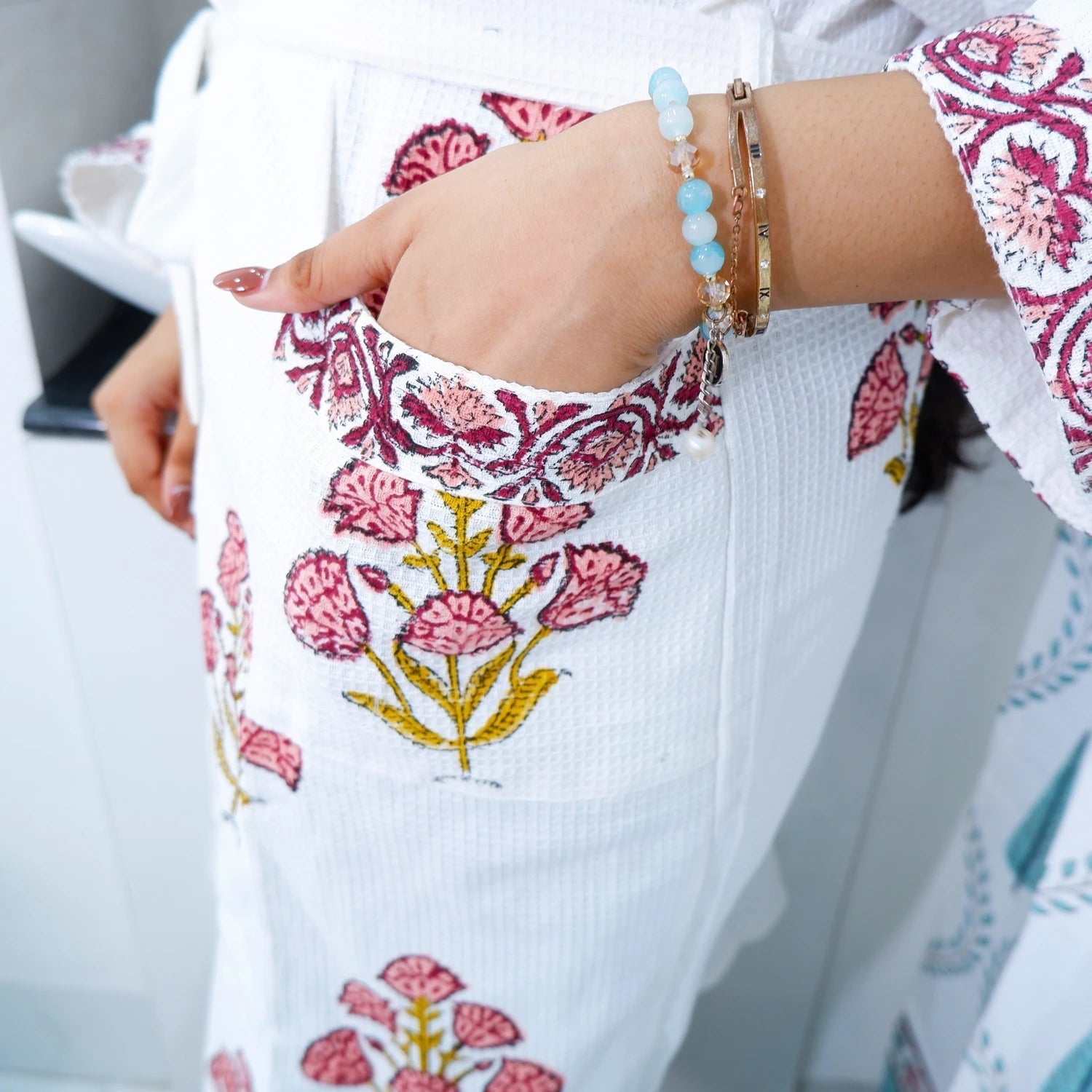 Hand block printed cotton bathrobe featuring floral designs and convenient pockets for comfort